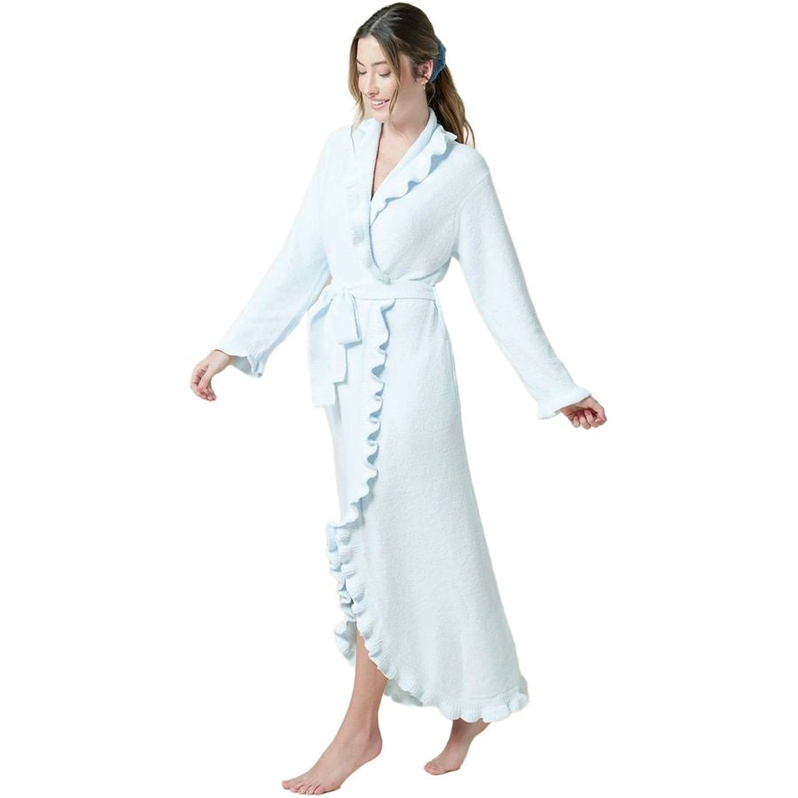 A woman modeling a light blue long-sleeve bathrobe with ruffled trim and a tie belt, shown against a plain white background.