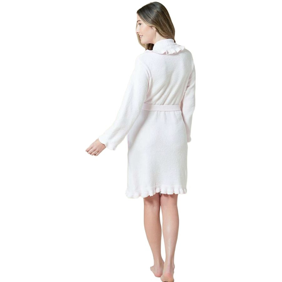 A woman wearing a white long-sleeve robe with a ruffled collar and a matching waist tie, shown from the back against a plain white background.
