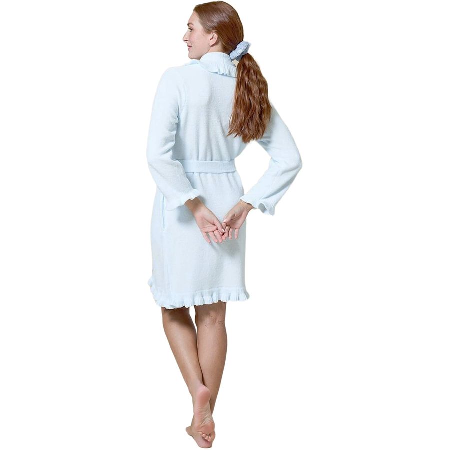 A woman wearing a light blue bathrobe, shown from the back against a plain white background.