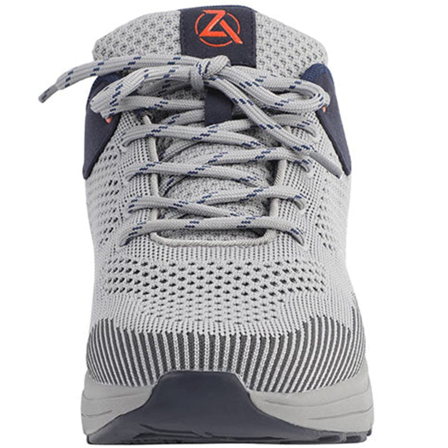 Gray athletic shoe with blue accents on a white background
