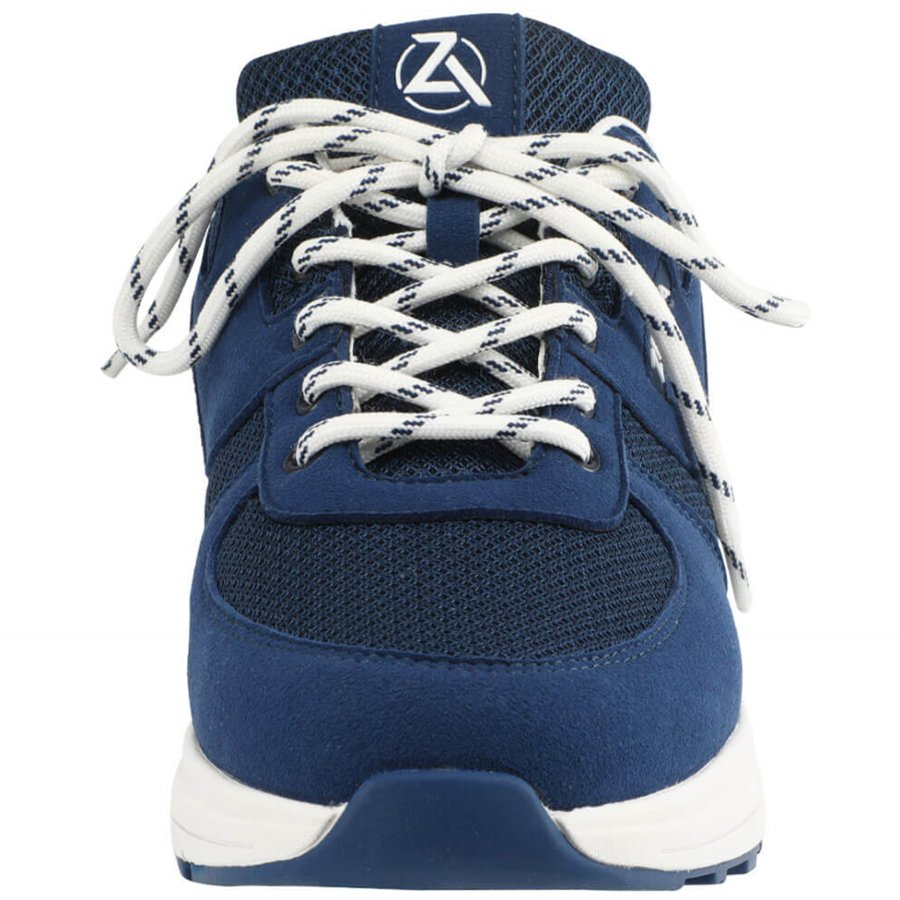 Blue athletic shoe with white laces on a white background