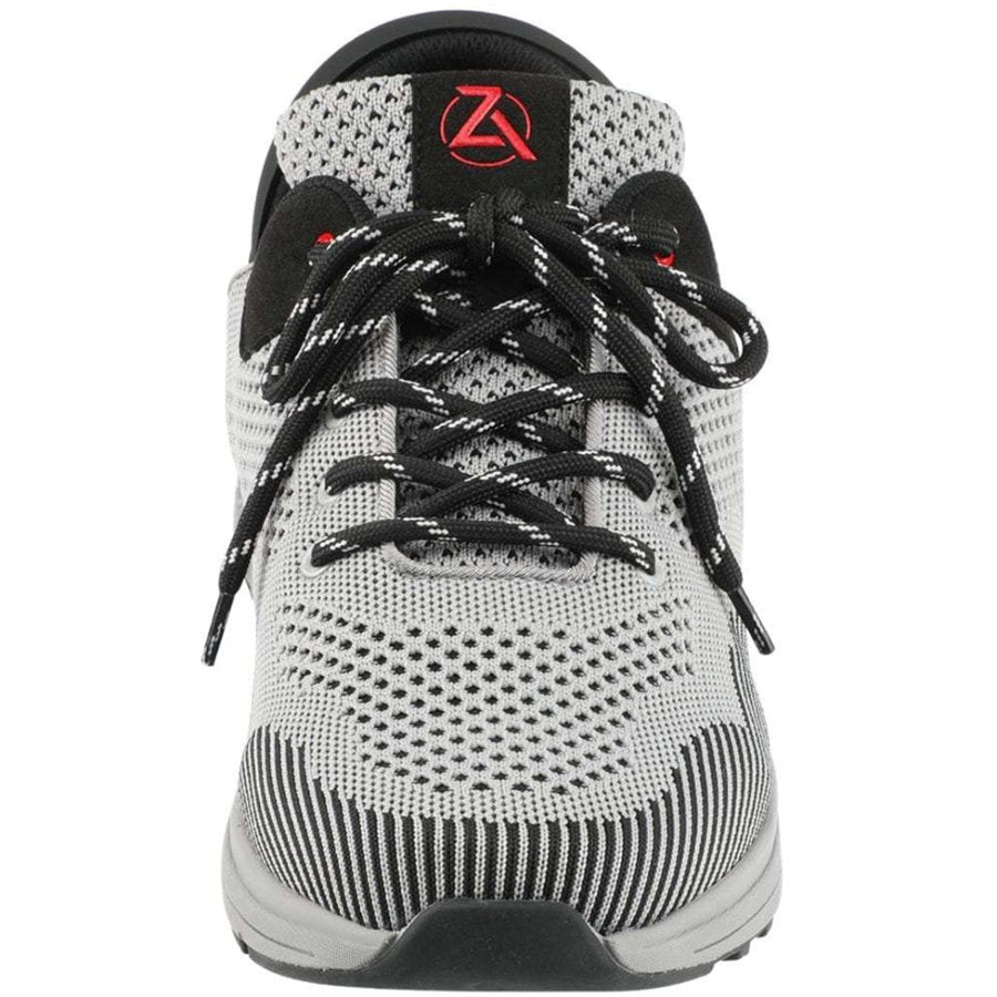 White and black athletic shoe with a brand logo on a white background