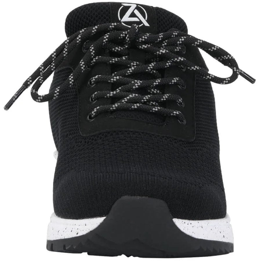 Black sneaker with white sole on a white background