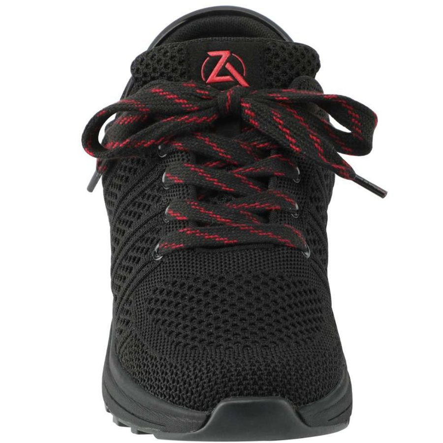 Black athletic shoe with red laces on a white background
